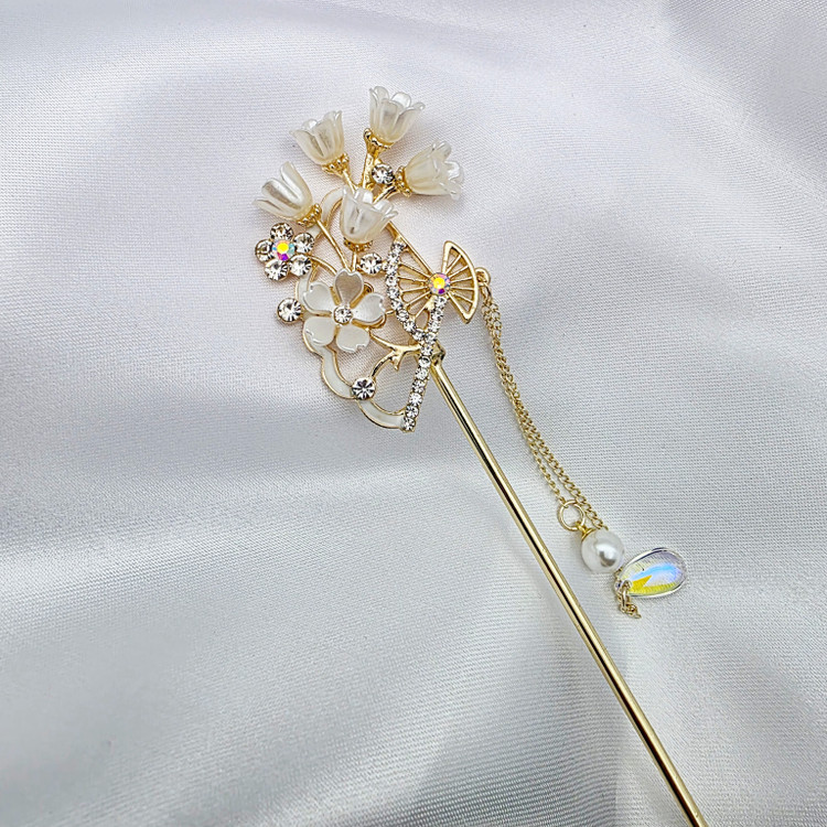 خرید کانزاشی طلایی زنانه با طراحی سنتی و نگینهای کریستالی از Gissoo1.ir. مناسب برای مجالس رسمی و عروسی، با کیفیت عالی و ارسال سریع به سراسر ایران.